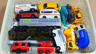 Box full of various miniature cars Police Car, Volvo, Garbage Truck, Maserati, Ambulance, Peugeot 13