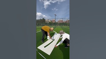 Do you know how to draw lines on an artificial grass football court?