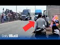 Terrifying moment truck plows into spectators killing three people during street race in Mexico