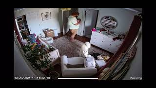 Dad walks into room then baby farts and poops on towel while being held (Security camera)