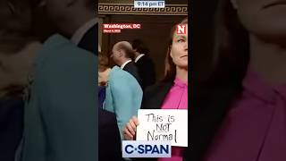 Democrat Holds 'This Is Not Normal' Sign As Trump Enters Chamber