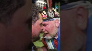 Scotland fans hugs ITV News reporter while celebrating win