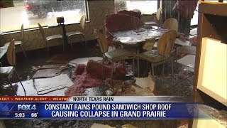 Heavy rain causes street flooding, caves in sandwich shop roof