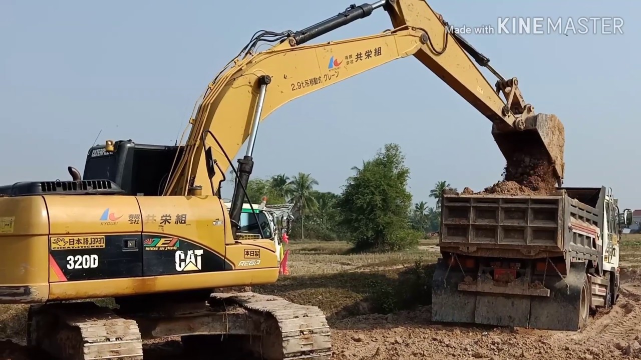 Excavator CAT 320D work in the field - YouTube