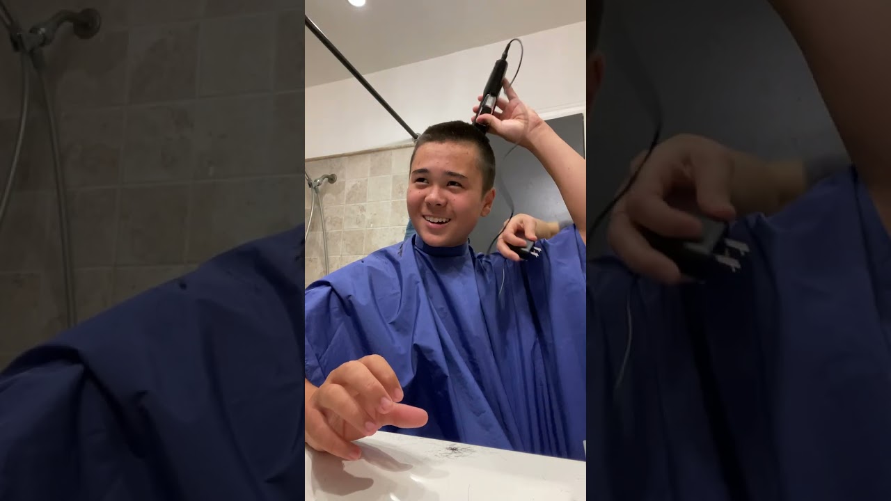 His very first buzz cut