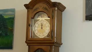 Four antique clocks (combined ages approximately 400 years old) ringing midnight.