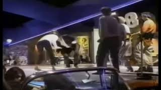 Quentin Tarantino dancing along with Uma Thurman and John Travolta during  the famous dance scene.