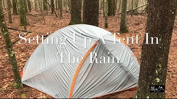 Setting Up A Tent In The Rain