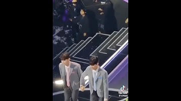 Sung han bin & zhang hao boys planet holding their hands together to their seat in final debut zb1