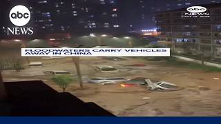 Floodwaters carry vehicles away in China
