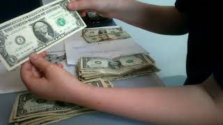 searching through 1 dollar bills