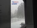 Whipping rain swiftly turned into snow in upstate New York as a cold front surged through the region