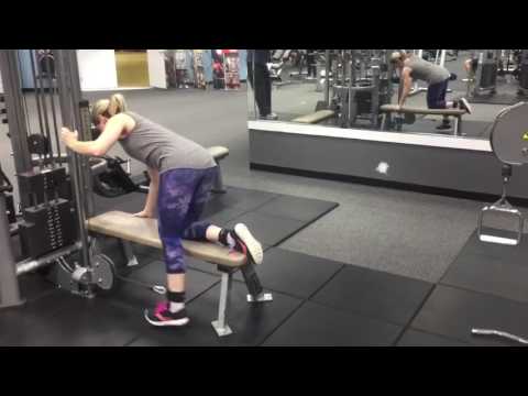 Straight leg cable kickbacks, kneeling on bench