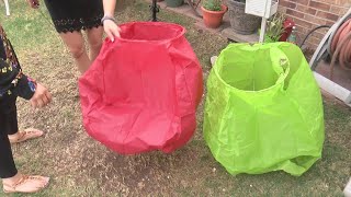 Family finds burning paper lanterns flying over city during fire in Bosque