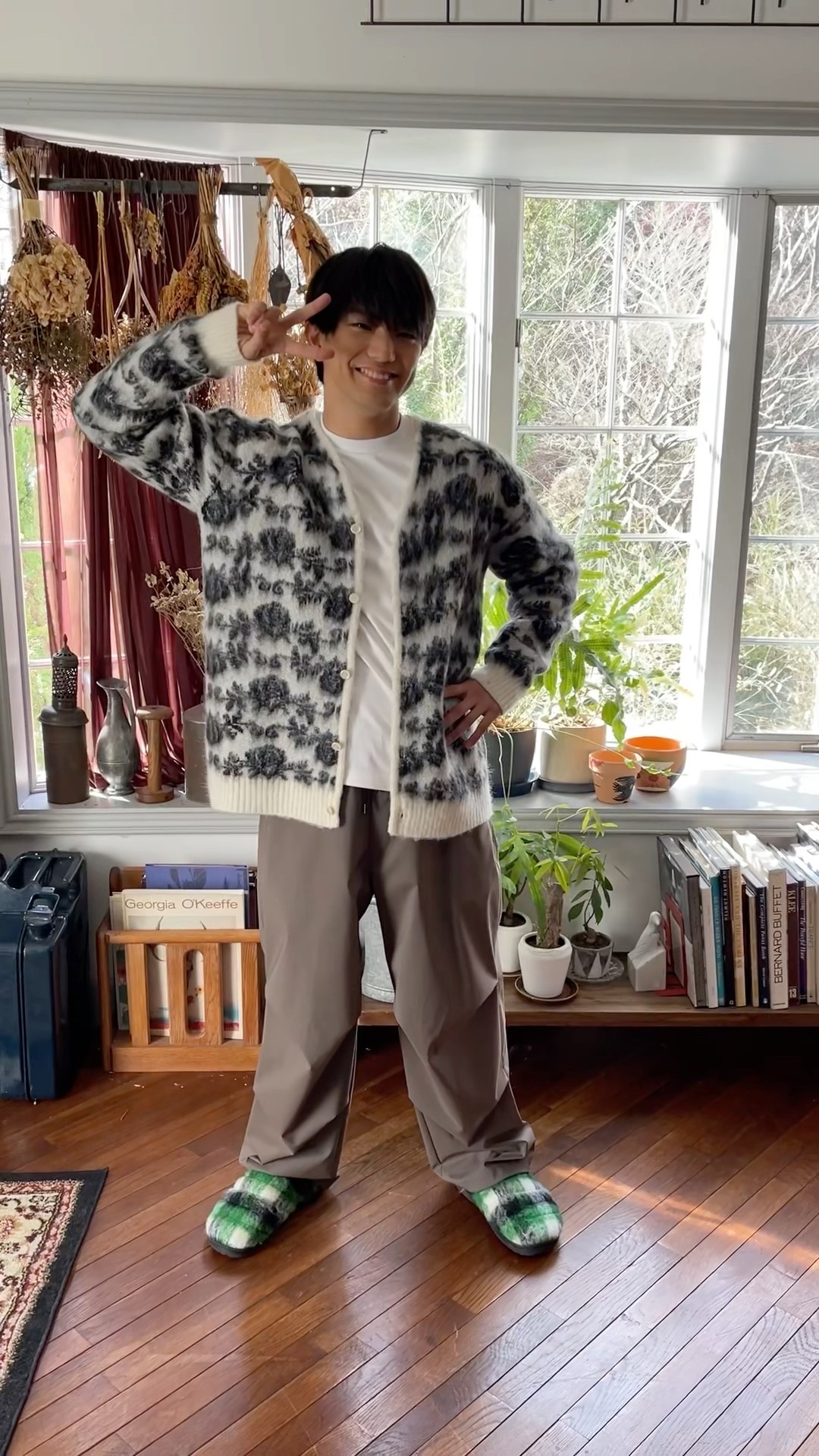 Yoshinori Masakado holds up his hand to the camera and