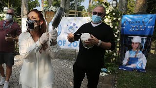 Graduating seniors honored in caravan parade get a special message from Gloria and Emilio Estefan