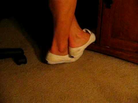Laceless white Keds shoe play at work
