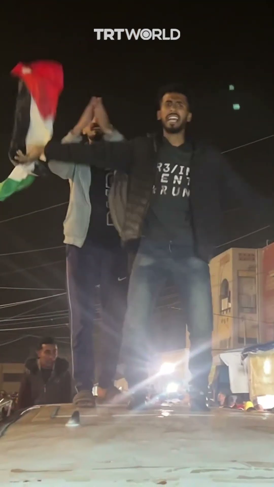 Palestinians celebrate ceasefire with flags and chants in Khan Younis, Gaza