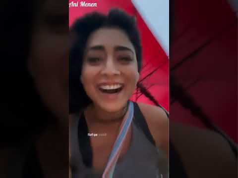 Shriya Saran Enjoys in Breezy Weather with Red Umbrella Latest Video