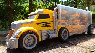 We will store construction heavy equipment minicars in a big yellow trailer truck!