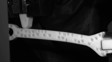 Wrench #3 : functionally graded material with random positioning of unit cells