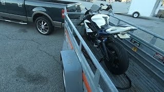 Securely tow motorcycle on u-haul trailer using rear paddock stand & choke