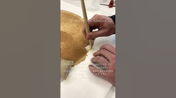 Japanese tissue hinging of artwork for conservation framing