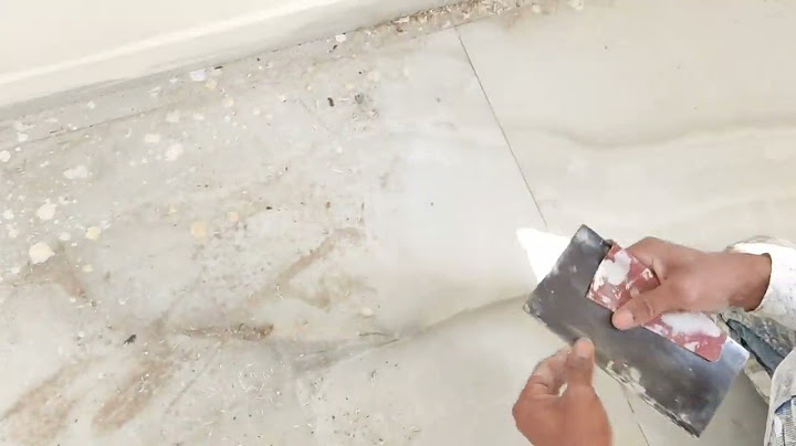 How to get dry paint off tile floor