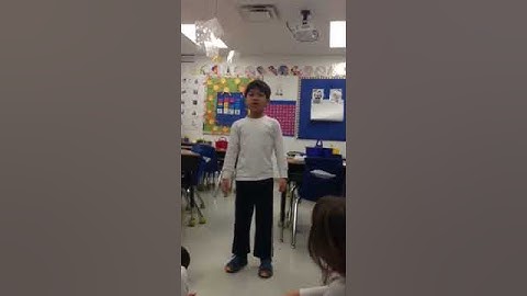 A first grade student recites a spring time poem in Spanish!