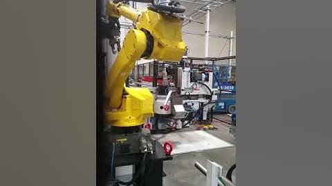 Fanuc M710ic unloading bended exhaust from a Crippa bender