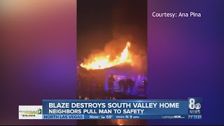 Neighbors rush to help homeowner after house goes up in flames