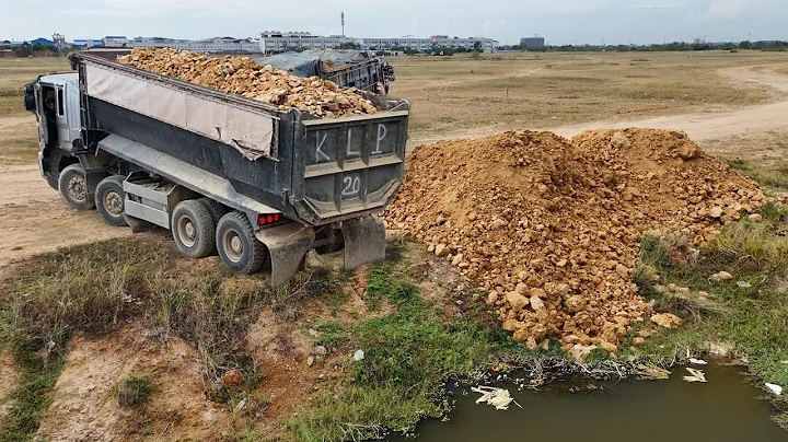 Process great work !! Land filling by Huge trucks Dumping soil & push by KomatSu Dozer