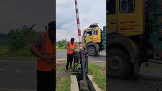 Operating the manual railway crossing gate, ensuring safety on the tracks. #shorts #gates #tracks