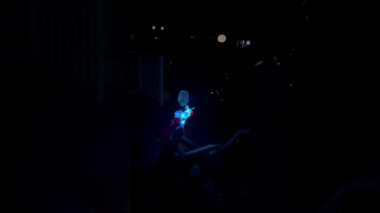 Gel blaster glowing at night. 