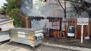 Flames Behind Fence on V St. in Eureka