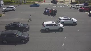 Florida drivers help person inside flipped car after crash in Daytona Beach