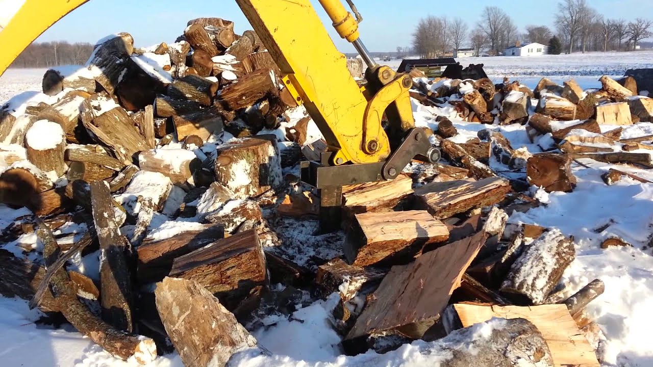 Splitting firewood made easy with Custom Backhoe Splitter - YouTube