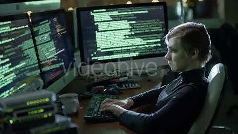 Female Programmer Writing Program Code at Night