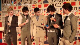 One Direction in the Brits winners room.