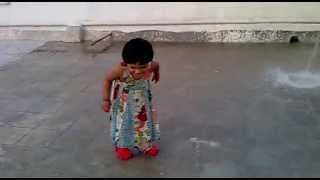 Cute Little Girl playing in water