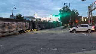 Two CSX locomotives lead a south bound mixed freight down Winslow Street in Fayetteville 8/12/2026
