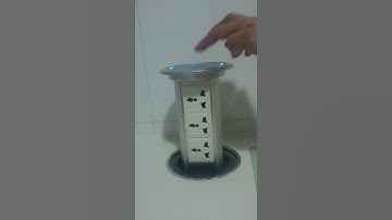 Motorised pop up socket