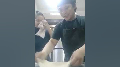 how to roll out and shape pizza dough thin with rolling pin.