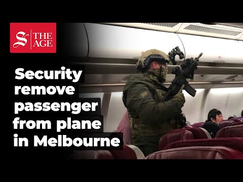 Security remove passenger from plane in Melbourne