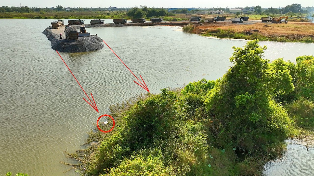 Amazing road construction, stone truck carrying fill rock, making a new road with Dozer in progress
