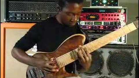 Tosin Abasi playing custom 8 string guitar