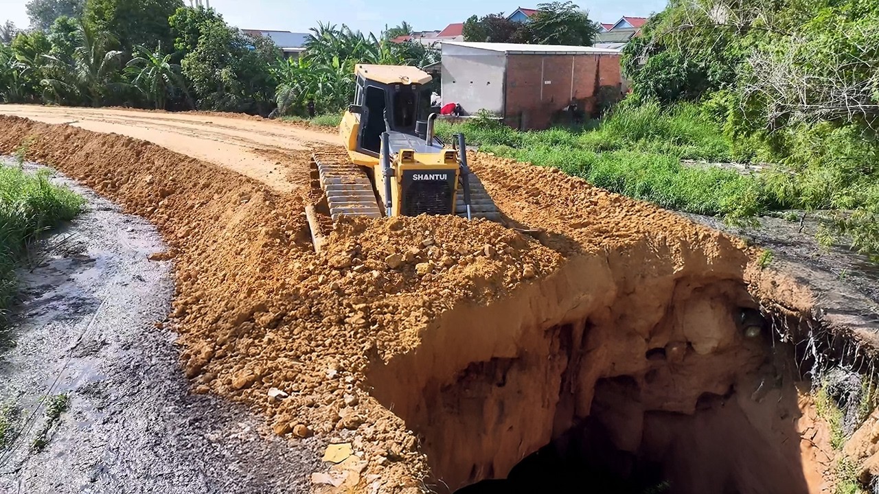 Continue the project, using SHANTUI DH-17C2 bulldozers and heavy trucks for ongoing projects.