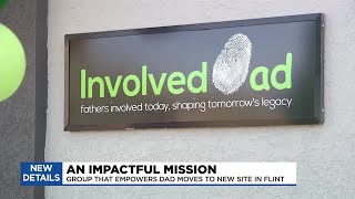 Involved Dad ribbon cutting in Flint