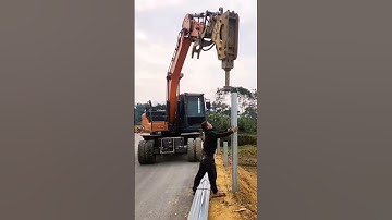 Ép cọc bằng máy múc