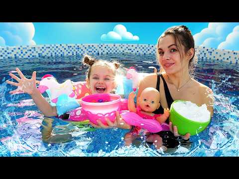 Maya looks for toy eggs with Orbeez balls inside, and then goes swimming with them.